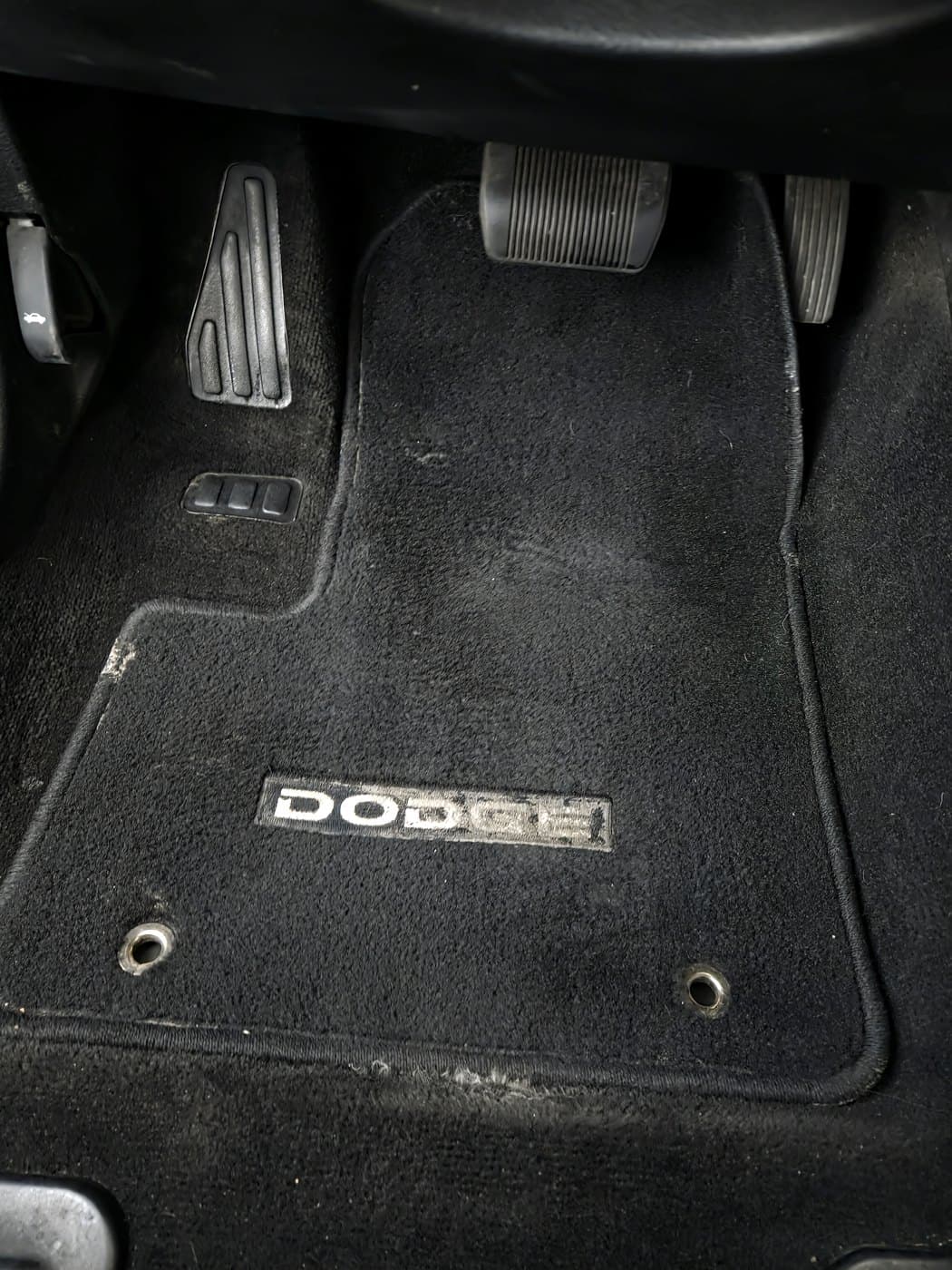 Driver side floor after cleanup with the floor mat installed again.